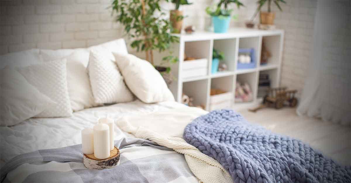 Cozy bedding with lots of wool pillows