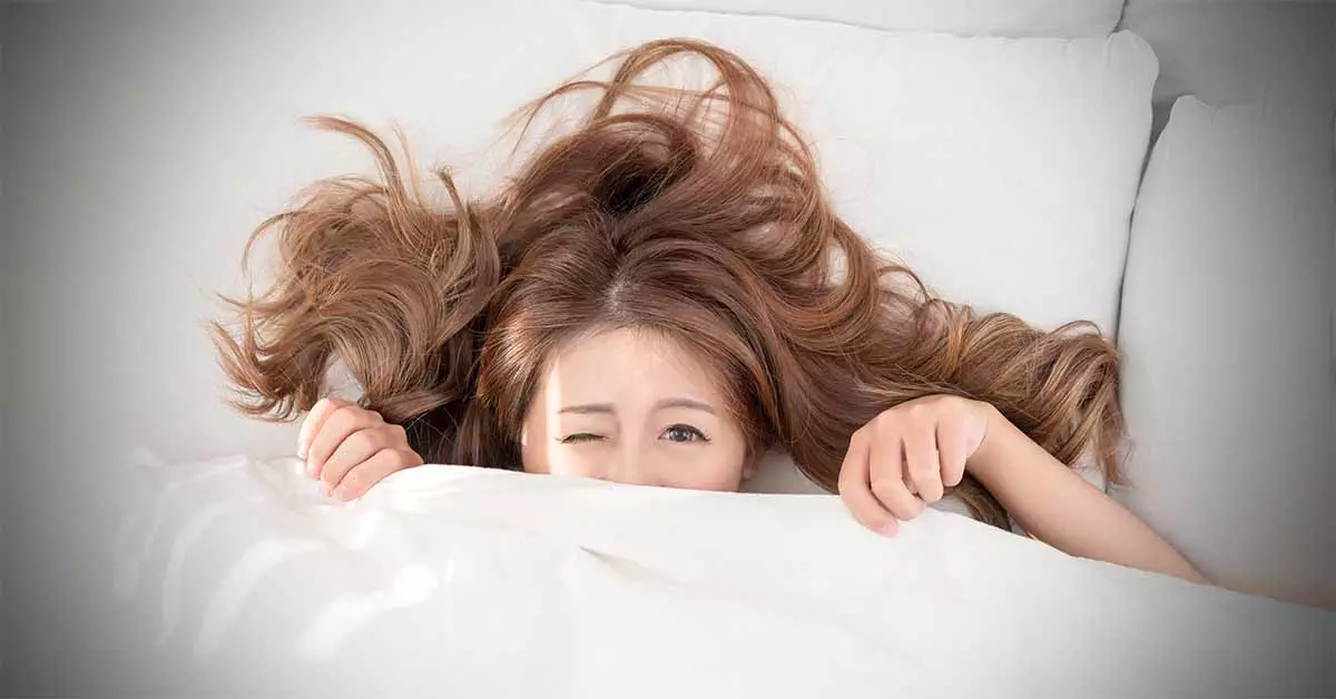 Girl waking up with one eye closed. What happens if you sleep with contacts?