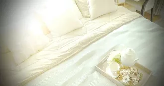 White bamboo pillows on a bed